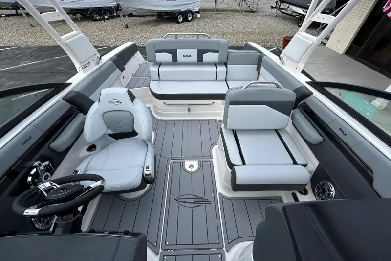 Slide: The Image of 2026 Chaparral SSX 4 boat interior with modern seating and sleek design. - 19