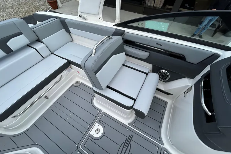 Slide: The Image of 2026 Chaparral SSX 4 boat interior with sleek gray seating and modern design. - 21