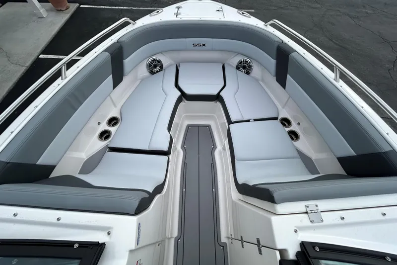 Slide: The Image of 2026 Chaparral SSX 4 boat interior with sleek gray seating and cup holders. - 22