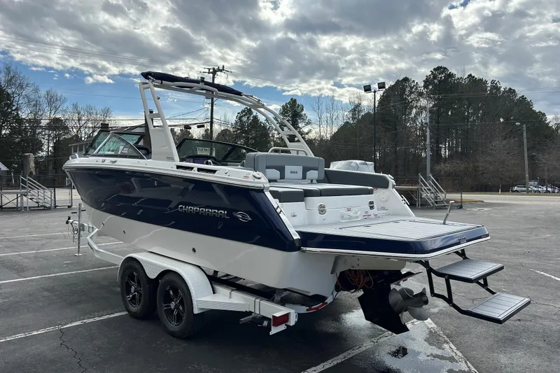 Slide: The Image of 2026 Chaparral SSX 4 boat on trailer, parked outdoors under cloudy sky. - 4