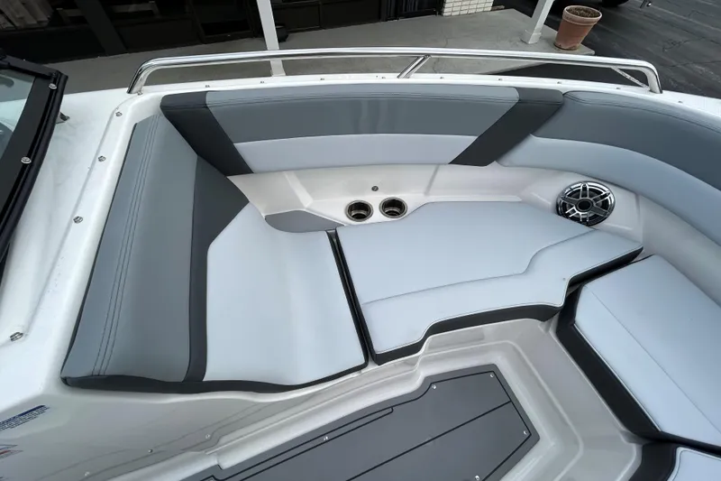 Slide: The Image of 2026 Chaparral SSX 4 boat interior with sleek gray seating and modern speaker system. - 6