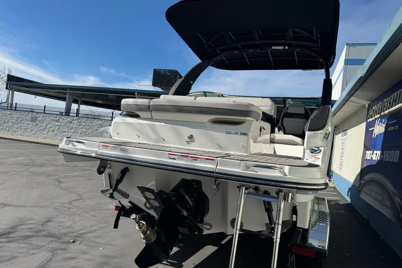 Slide: The Image of 2026 Sea Ray SLX 260 boat, rear view, showcasing sleek design and modern features. - 10