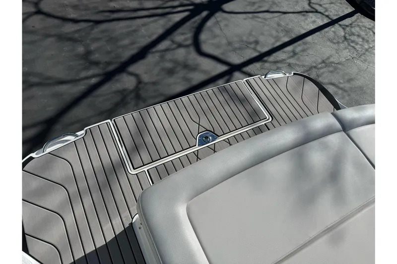 Slide: The Image of 2026 Sea Ray SLX 260 boat deck with sleek, modern design and comfortable seating. - 12