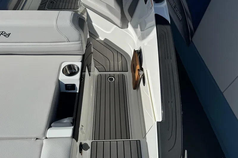 Slide: The Image of Interior view of 2026 Sea Ray SLX 260 boat with sleek seating and cup holder. - 16