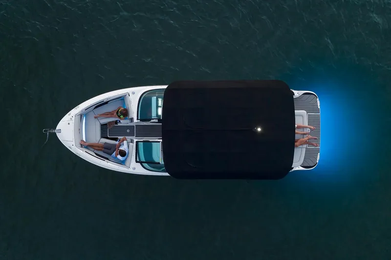 Slide: The Image of Manufacturer Provided Image: Aerial view of 2025 Sea Ray SLX 260 boat with blue underwater lights. - 2