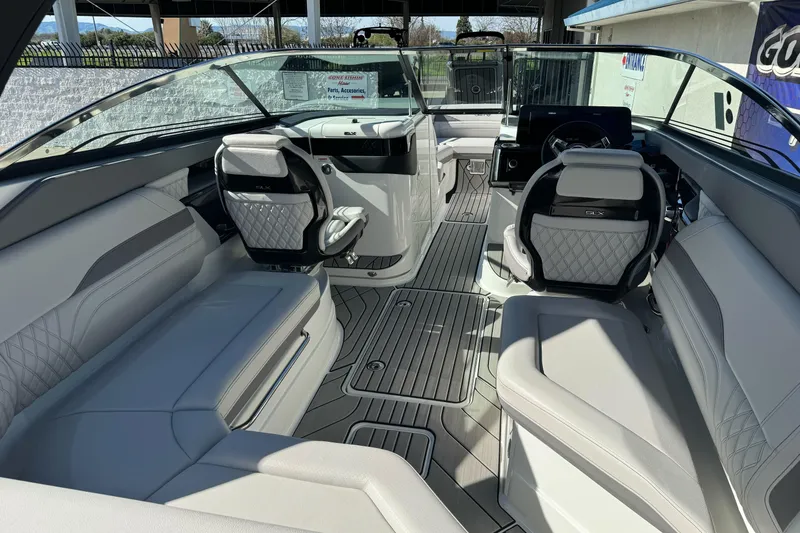 Slide: The Image of 2026 Sea Ray SLX 260 boat interior with luxurious seating and modern dashboard design. - 20