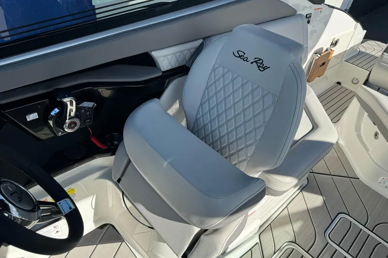 Slide: The Image of Luxury helm seat on 2026 Sea Ray SLX 260 boat, featuring elegant design and controls. - 27