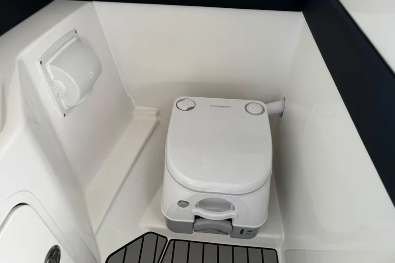 Slide: The Image of Portable toilet in 2026 Sea Ray SLX 260 boat interior. - 33