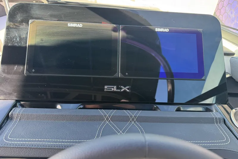 Slide: The Image of Dashboard of 2026 Sea Ray SLX 260 with dual Simrad displays. - 36