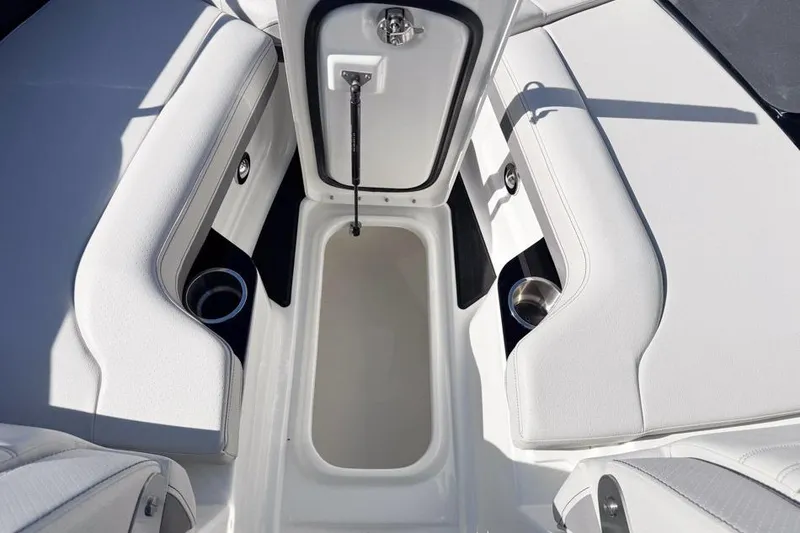 Slide: The Image of Interior view of 2026 Sea Ray SLX 260 boat with open storage compartment. - 44