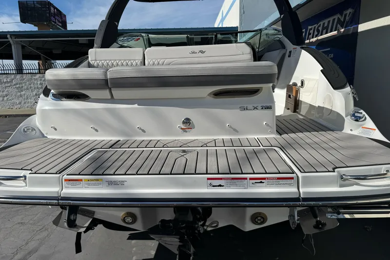 Slide: The Image of 2026 Sea Ray SLX 260 boat rear view with spacious deck and seating. - 7