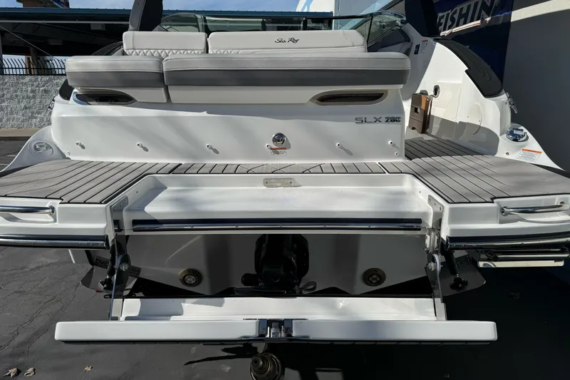 Slide: The Image of 2026 Sea Ray SLX 260 boat with sleek rear deck and seating area. - 8