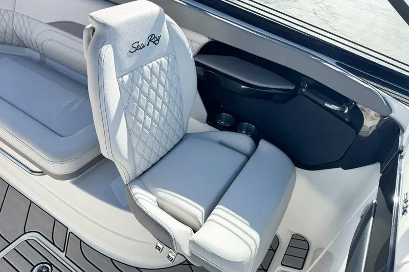 Slide: The Image of Luxurious seating in the 2026 Sea Ray SLX 260 boat, featuring elegant white upholstery. - 23