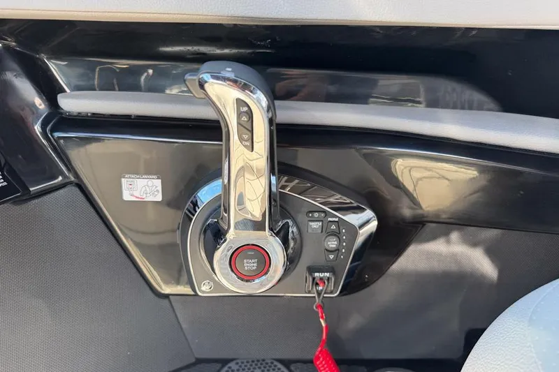 Slide: The Image of Control panel of 2026 Sea Ray SLX 260 boat with start-stop button and throttle lever. - 34