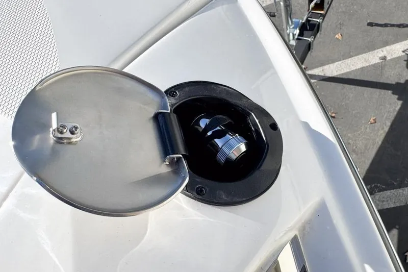 Slide: The Image of Fuel cap of 2026 Sea Ray SLX 260 boat, open on deck. - 43