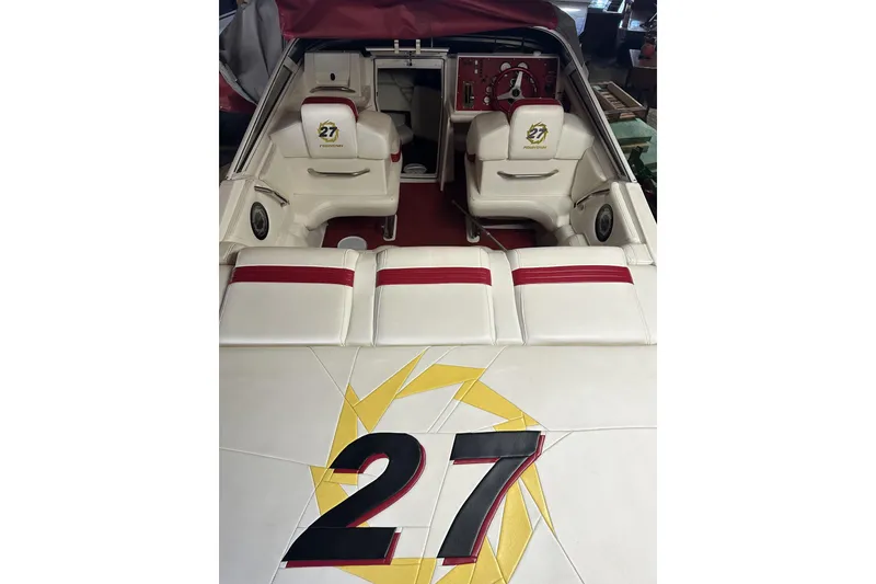 Slide: The Image of 2005 Fountain 27 Fever boat interior with white and red seating, featuring "27" logo. - 5