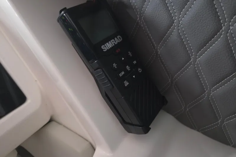 Slide: The Image of 2023 Sea Ray SLX 350 boat interior with modern seating and ambient lighting. - 16