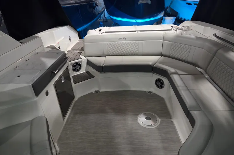 Slide: The Image of 2023 Sea Ray SLX 350 boat interior with luxurious seating and modern dashboard. - 22