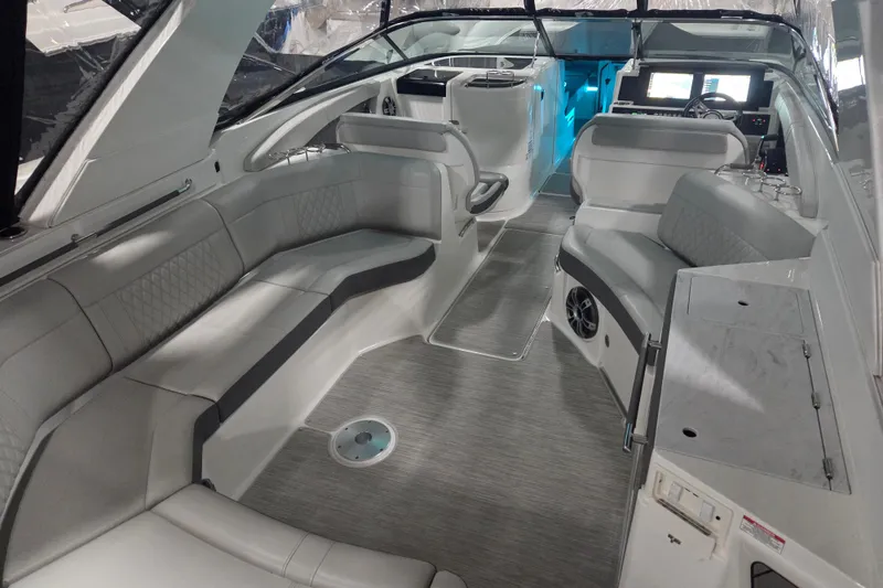 Slide: The Image of 2023 Sea Ray SLX 350 boat interior with sleek kitchenette and storage area. - 24