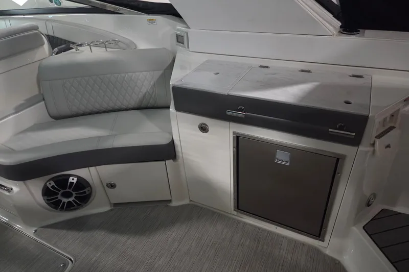 Slide: The Image of 2023 Sea Ray SLX 350 boat interior with sink and storage area. - 25