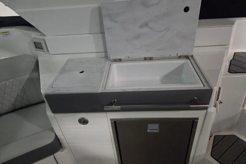 Slide: The Image of Twin 6.2L engines in a 2023 Sea Ray SLX 350 boat. - 27