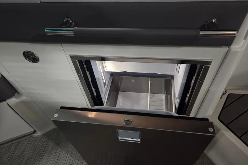 Slide: The Image of 2023 Sea Ray SLX 350 boat with dual MerCruiser Bravo engines and propellers. - 28