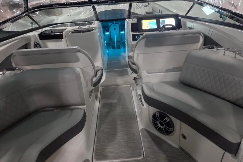 Slide: The Image of 2023 Sea Ray SLX 350 helm with luxurious seating and modern controls. - 34