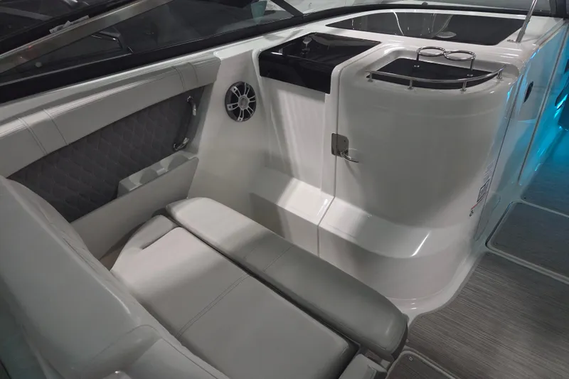 Slide: The Image of 2023 Sea Ray SLX 350 helm with luxurious seating and advanced controls. - 35