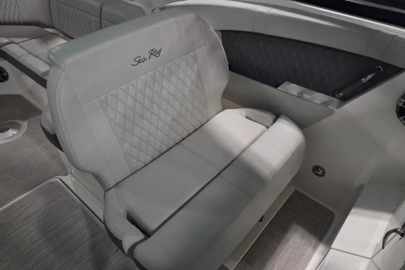 Slide: The Image of 2023 Sea Ray SLX 350 boat interior with luxurious seating and ambient blue lighting. - 38