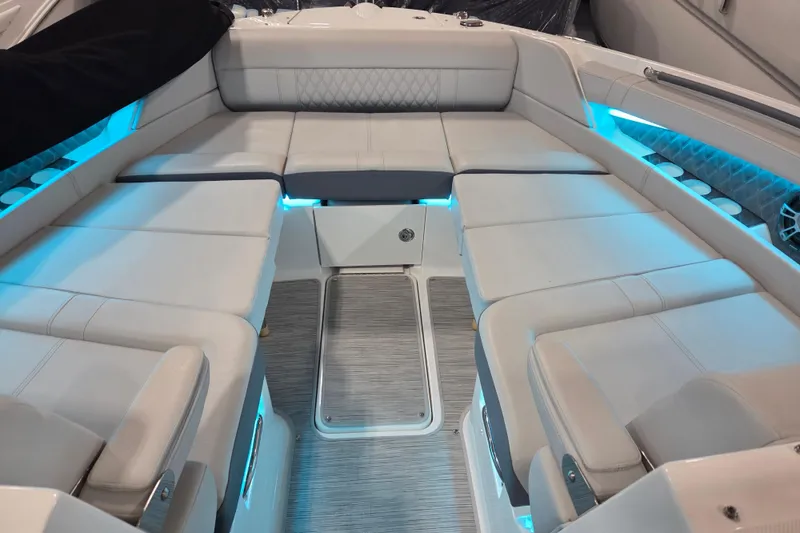 Slide: The Image of 2023 Sea Ray SLX 350 boat deck with "Blue Heaven" sign. - 40