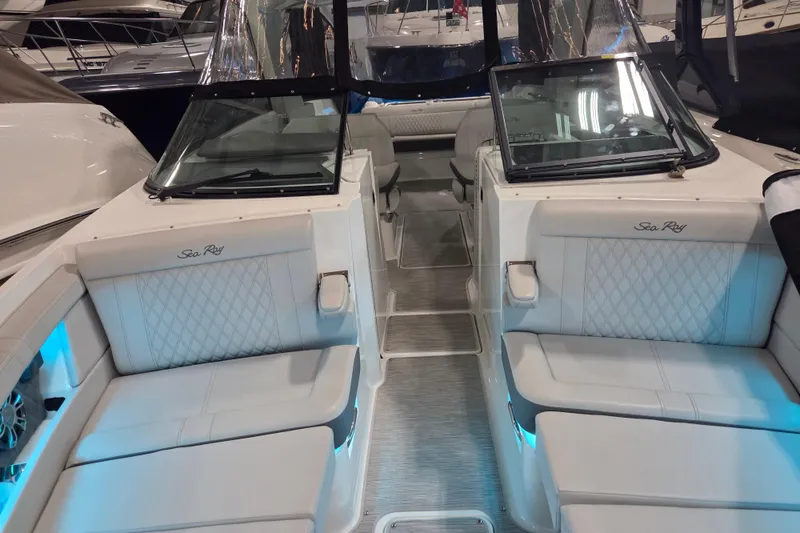 Slide: The Image of 2023 Sea Ray SLX 350 anchor compartment with chain and winch system. - 41