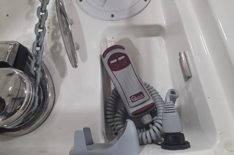 Slide: The Image of 2023 Sea Ray SLX 350 interior with beige cushioned seating and storage space. - 44