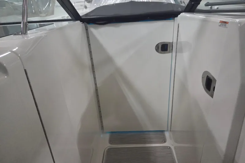 Slide: The Image of 2023 Sea Ray SLX 350 boat interior with blue LED lighting. - 50