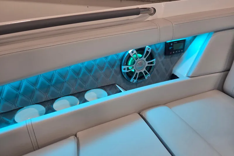 Slide: The Image of 2023 Sea Ray SLX 350 boat detail with LED light and Walstrom Marine sticker. - 58