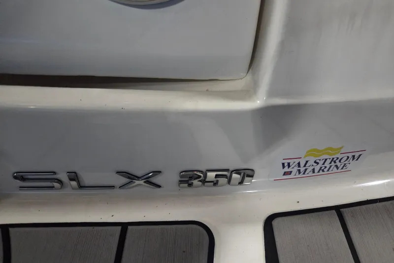 Slide: The Image of 2023 Sea Ray SLX 350 boat interior with speaker and storage compartment. - 61