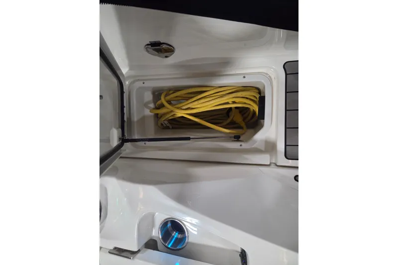 Slide: The Image of 2023 Sea Ray SLX 350 boat deck with speaker and cup holder. - 64