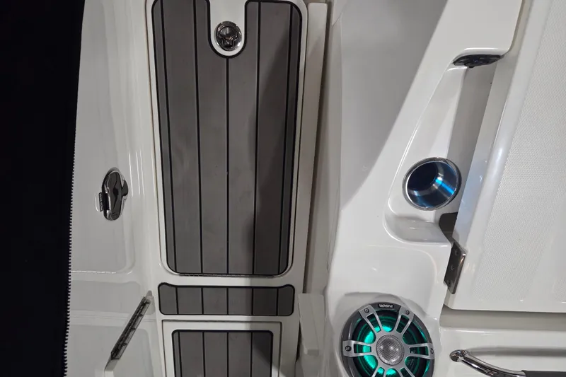 Slide: The Image of 2023 Sea Ray SLX 350 interior with open storage compartment and seating. - 65