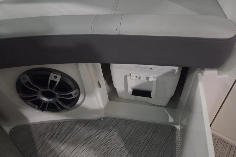 Slide: The Image of 2023 Sea Ray SLX 350 boat deck with storage compartment and speakers. - 66