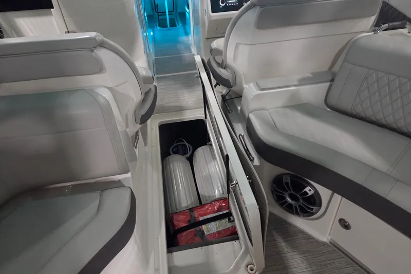 Slide: The Image of Control panel of 2023 Sea Ray SLX 350 boat with battery switches and keys. - 67