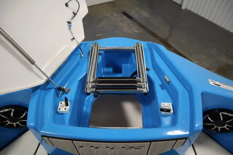 Slide: The Image of 2023 Yamaha Boats 222XD, blue deck with ladder and storage compartment. - 13