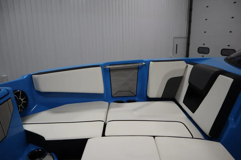 Slide: The Image of 2023 Yamaha Boats 222XD interior with blue and white seating in a modern design. - 15
