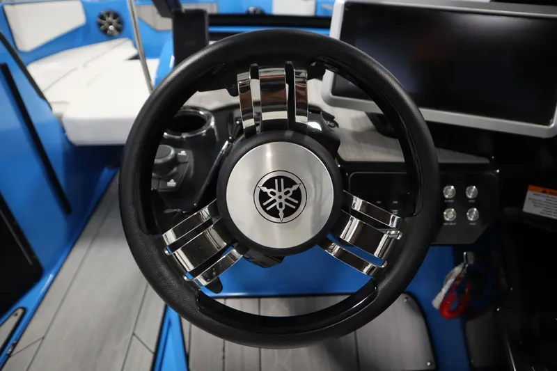 Slide: The Image of Steering wheel of 2023 Yamaha Boats 222XD, featuring sleek design and modern controls. - 19