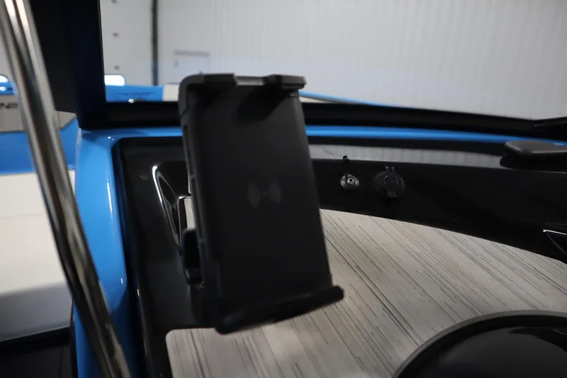 Slide: The Image of 2023 Yamaha Boats 222XD dashboard with phone holder and sleek design. - 20