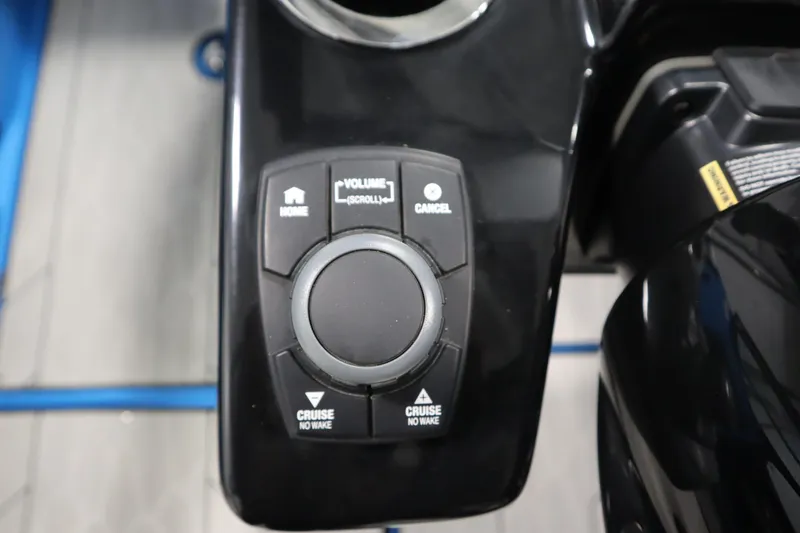 Slide: The Image of Control panel of 2023 Yamaha Boats 222XD with buttons for home, volume, and cruise. - 23