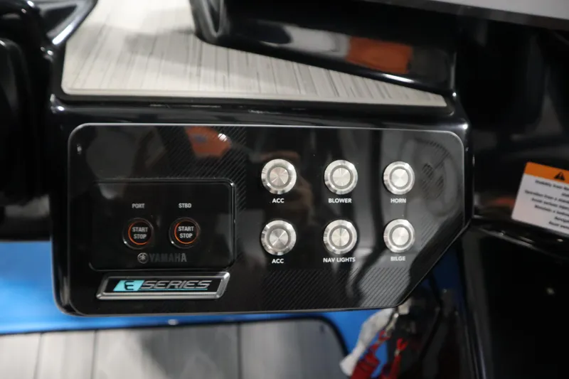 Slide: The Image of Control panel of 2023 Yamaha Boats 222XD with start/stop buttons and accessory switches. - 24