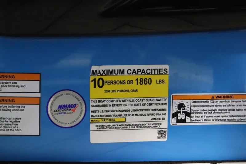 Slide: The Image of 2023 Yamaha Boats 222XD capacity label, maximum 10 persons or 1860 lbs, safety warnings included. - 26