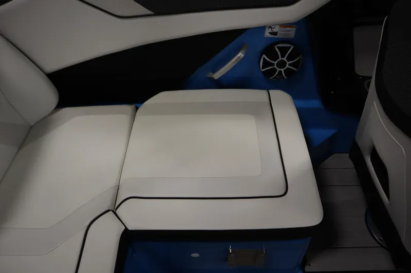 Slide: The Image of 2023 Yamaha Boats 222XD interior seating with speaker and blue accents. - 38