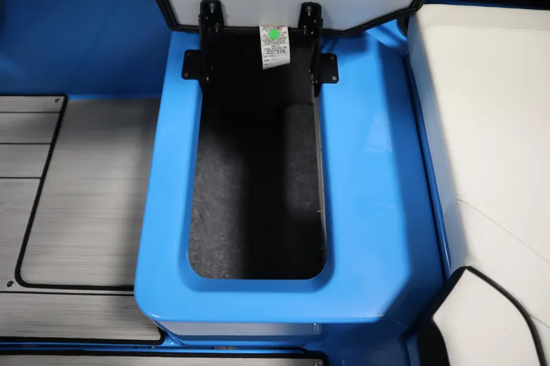 Slide: The Image of 2023 Yamaha Boats 222XD storage compartment with blue and white interior design. - 42