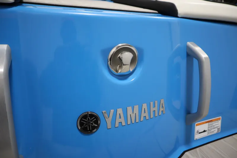 Slide: The Image of 2023 Yamaha Boats 222XD, blue exterior with logo and handle detail. - 47