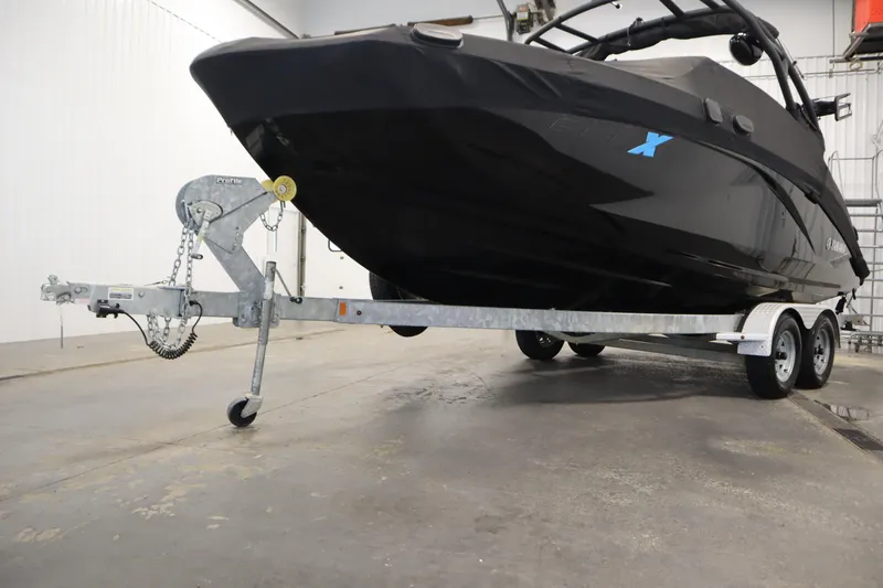 Slide: The Image of 2023 Yamaha Boats 222XD on trailer in indoor storage facility. - 53